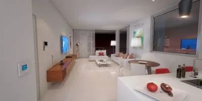 A Living Room with A Couch, Table, Chairs and A Television — Nambucca Plumbing in Nambucca Heads, NSW