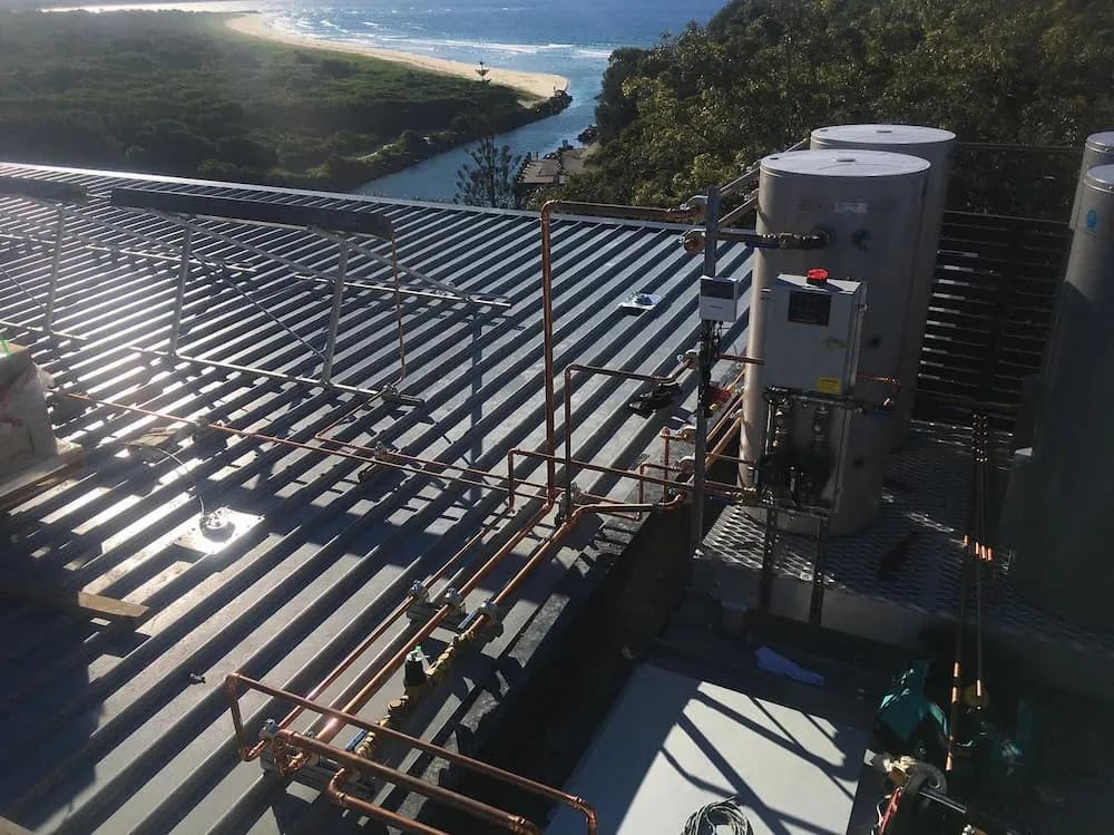 There Are a Lot of Pipes on The Roof of A Building — Nambucca Plumbing in Nambucca Heads, NSW