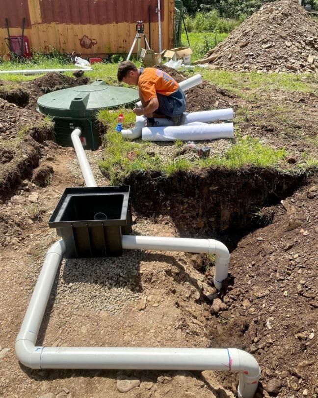 Person Assembling PVC Drainage Pipes on the Coffs Harbour