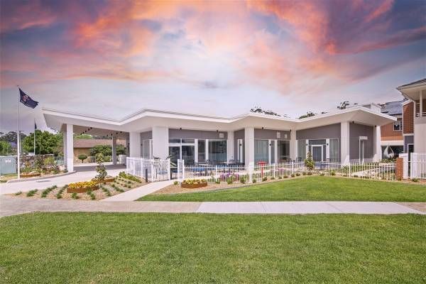 A Large White House with A Large Lawn in Front of It — Nambucca Plumbing in Nambucca Heads, NSW