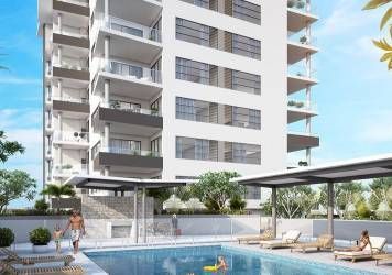 An Artist's Impression of A Swimming Pool in Front of A Tall Building — Nambucca Plumbing in Nambucca Heads, NSW