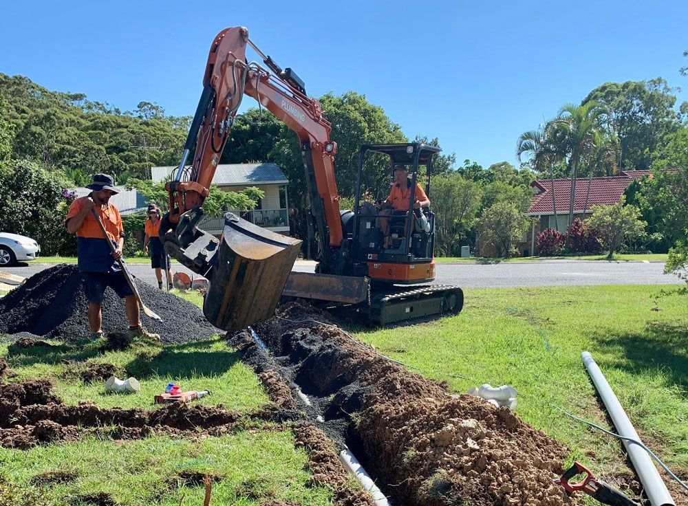Plumbers In Coffs Harbour Working On Underground Pipes