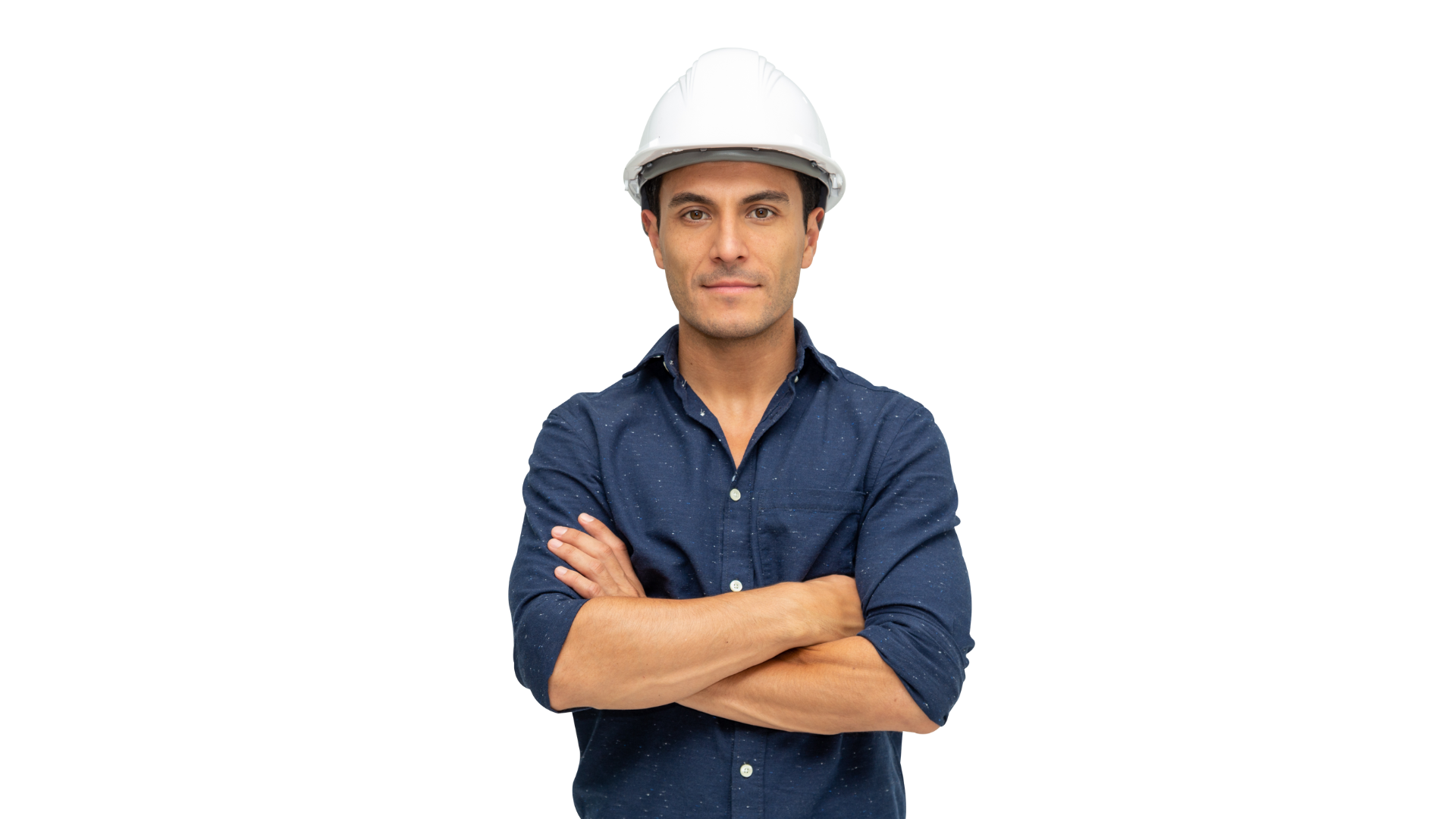 A man wearing a hard hat and a blue shirt is standing with his arms crossed.