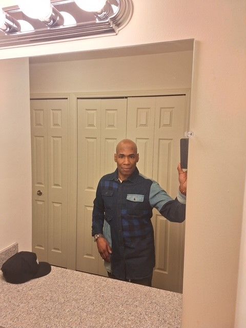 A man taking a selfie in front of a mirror