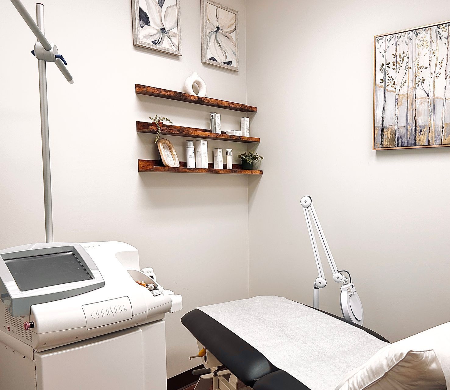 A woman is getting a laser hair removal treatment on her face.