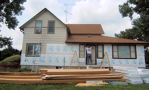 Installing siding on the exterior of the house in Table Rock, NE