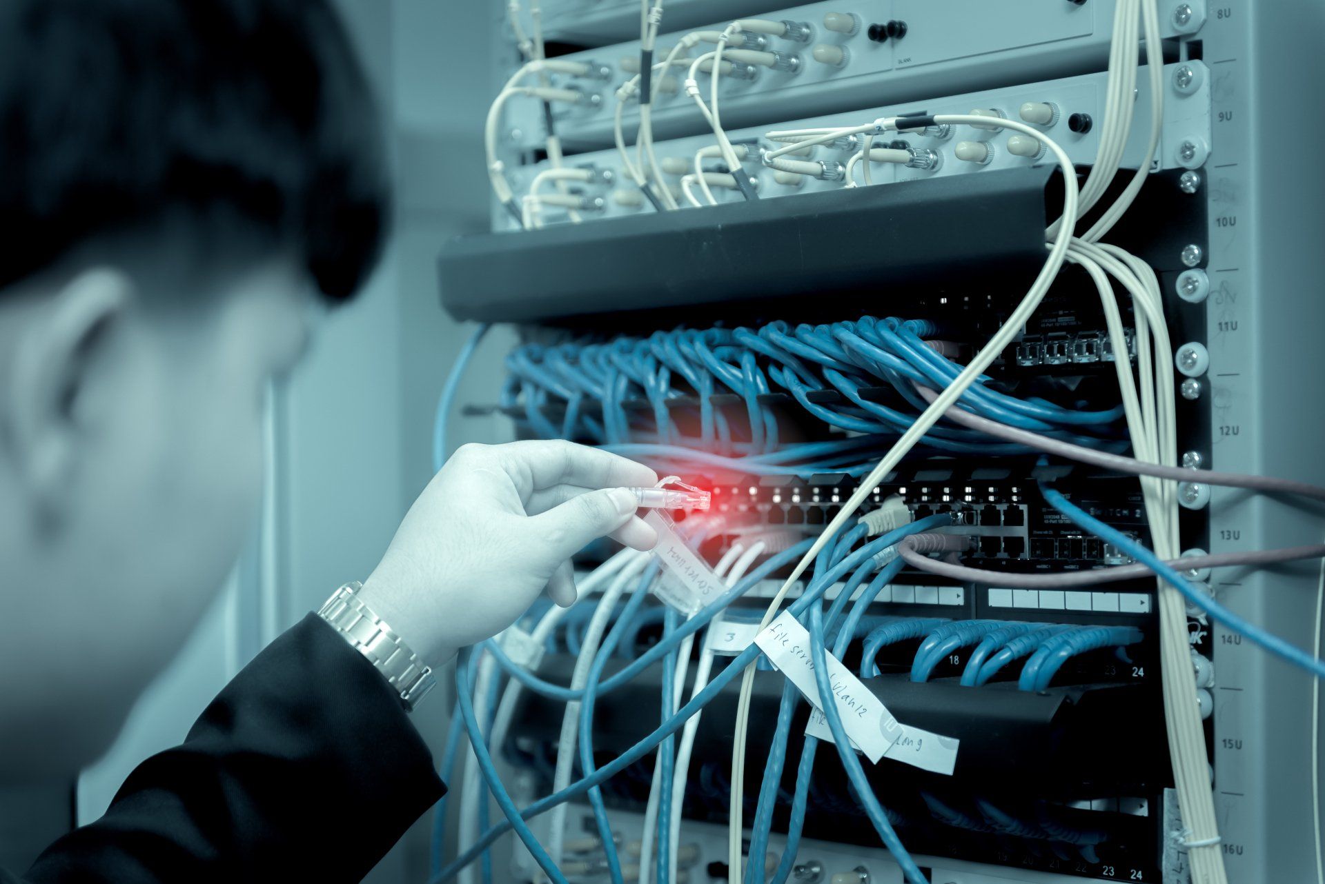man placing network cables