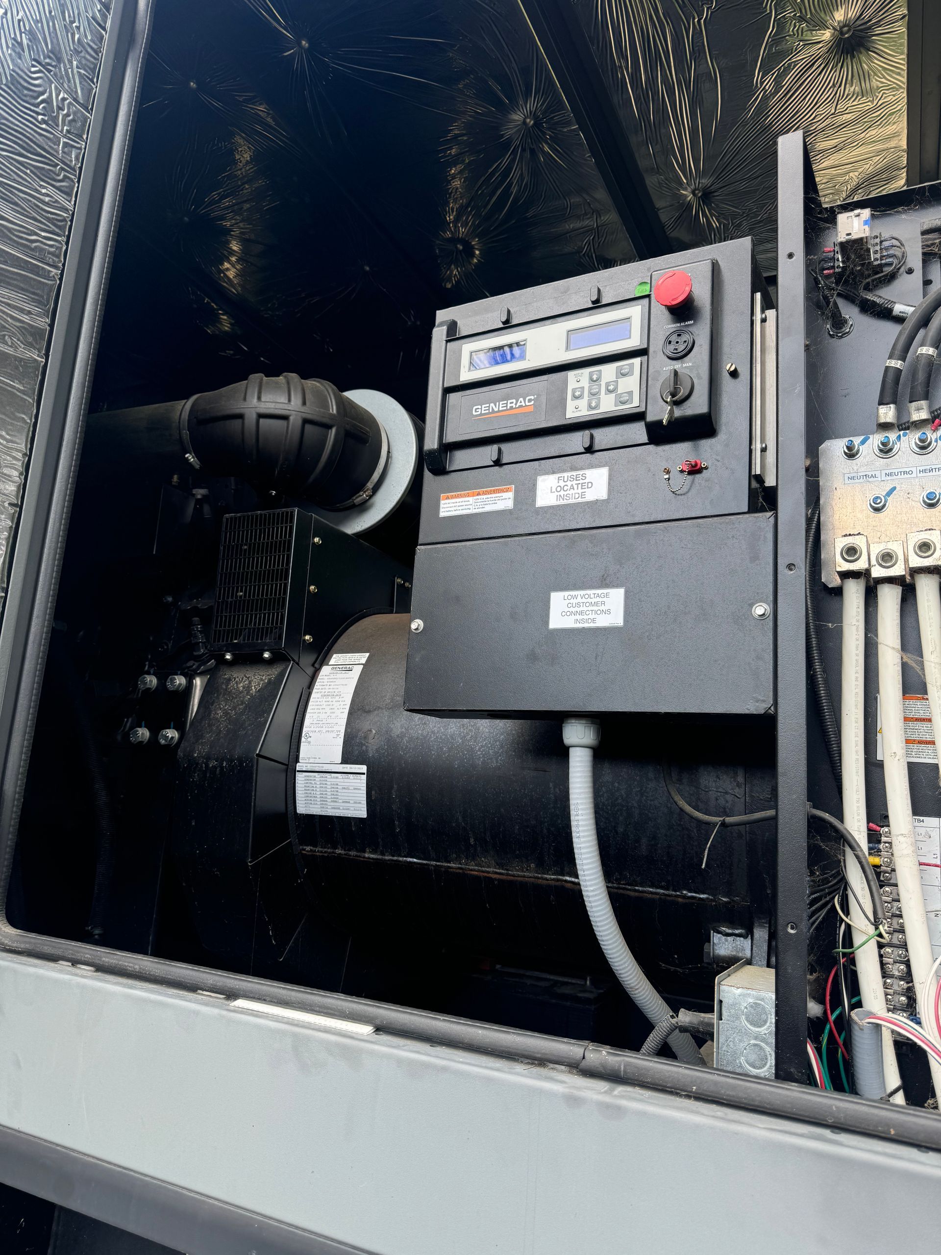 American Electric LLC | A close up of a machine with a battery in it.