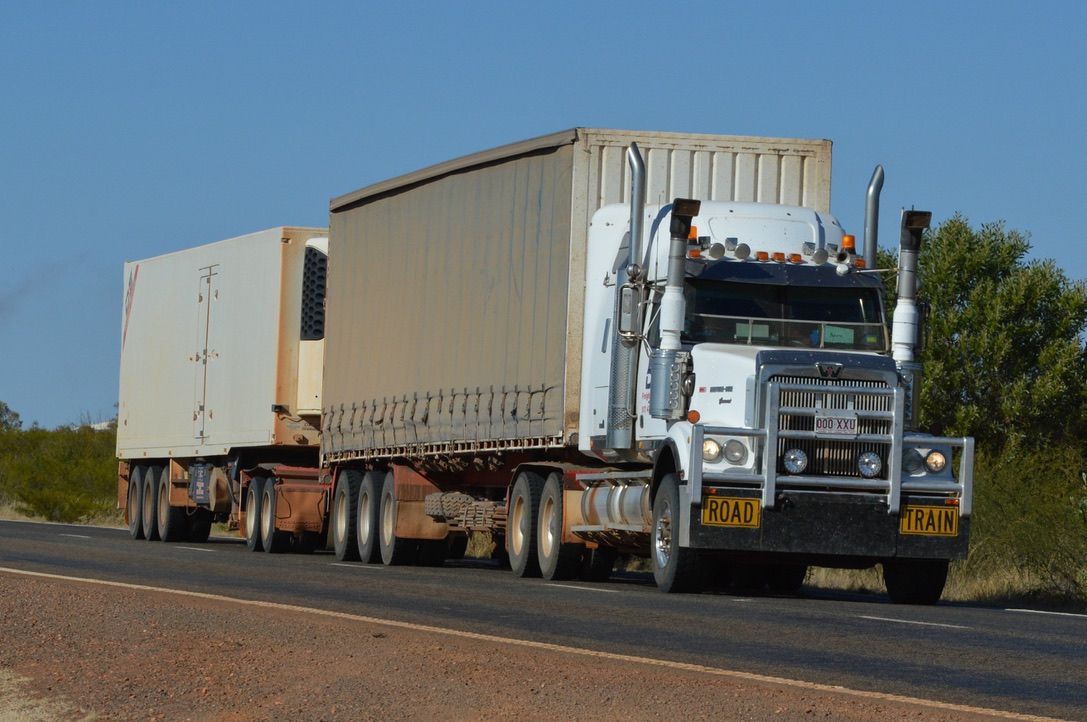 Semi-Trailer Carrying Soil Compactor — Freight Company in Mount Isa, QLD