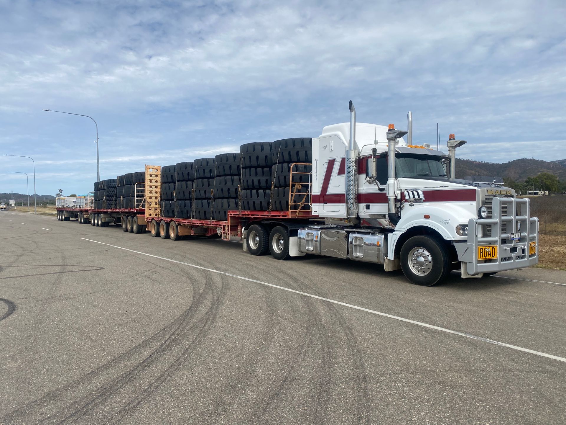 Red Pickup Loaded onto Truck — Freight Company in Mount Isa, QLD