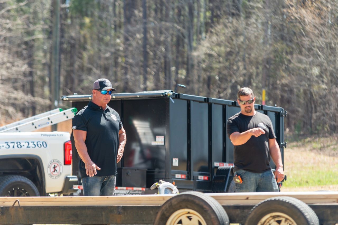 Two Man In Black Shirts — Greenwood, SC — Roofing Unlimited & More