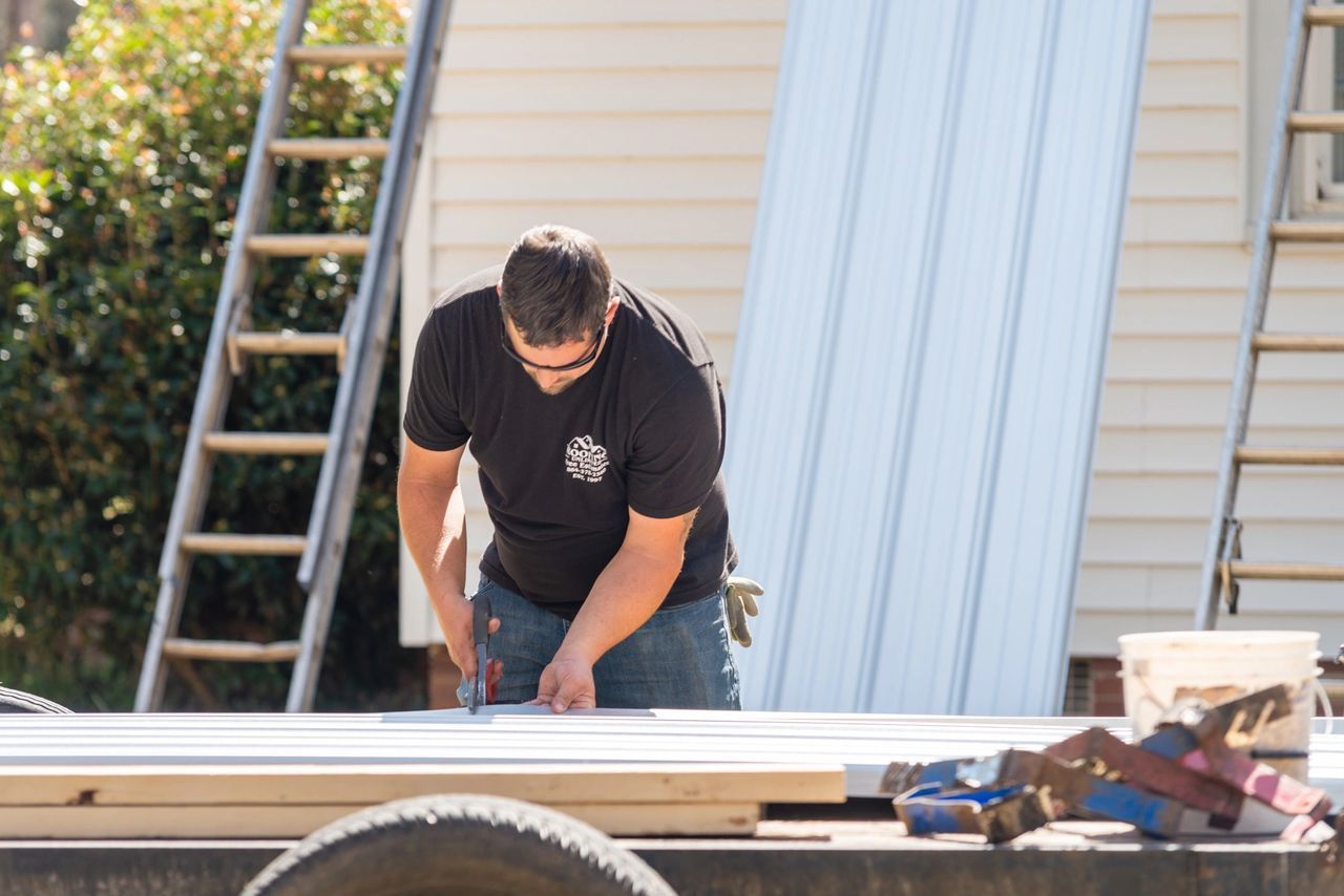 Man Cutting Wood — Greenwood, SC — Roofing Unlimited & More