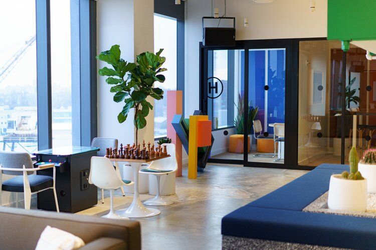 an office space with a chess board on the table