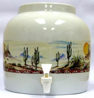 Ceramic water dispenser with desert landscape design and spigot.