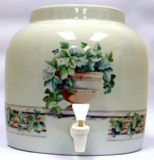 Ceramic water dispenser with floral design and spigot, on a light background.