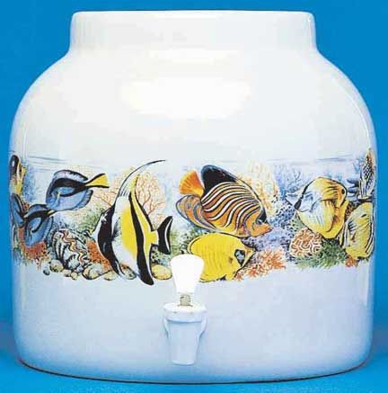 White ceramic water dispenser with tropical fish design; a spigot is visible.