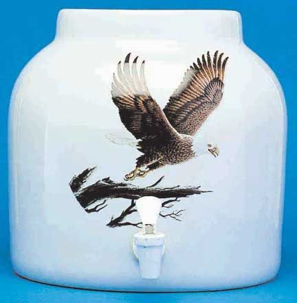 White ceramic water dispenser with an eagle design.