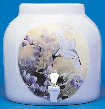 White ceramic water dispenser with hummingbird and flower design.