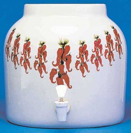 White ceramic water dispenser with red chili pepper design and spigot.