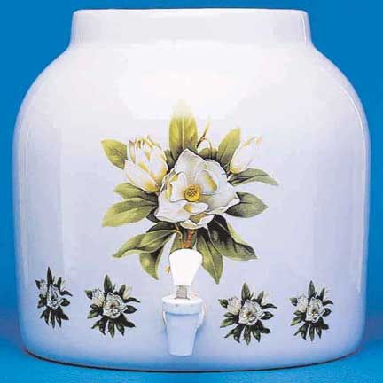 White ceramic water dispenser with floral design.