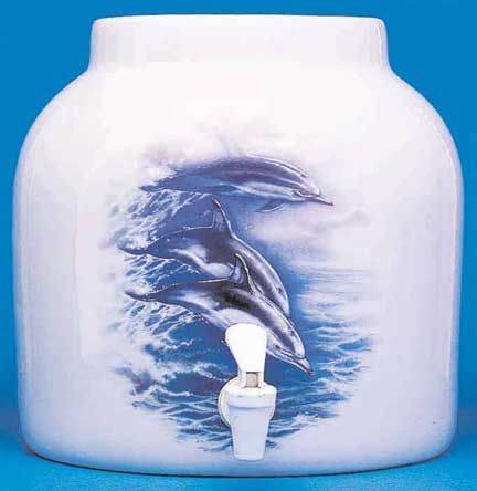 White ceramic water dispenser with dolphins, a spigot, and ocean scene.
