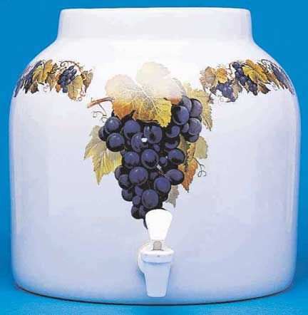 White ceramic beverage dispenser with grape motif and spigot.