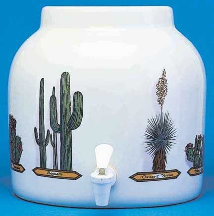 White ceramic drink dispenser with cactus illustrations and spigot.