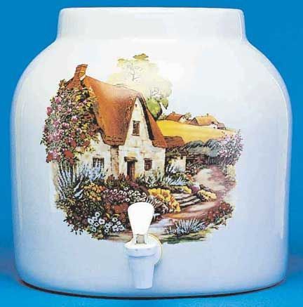 White ceramic water dispenser with cottage scene.