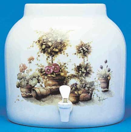 White ceramic water dispenser with floral print and spigot.