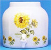 White ceramic beverage dispenser with lemons and strawberries design, spigot visible.