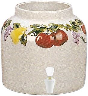 Ceramic beverage dispenser with fruit design and a white spigot.