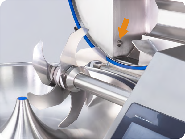 A close up of a machine with an orange arrow pointing to the right