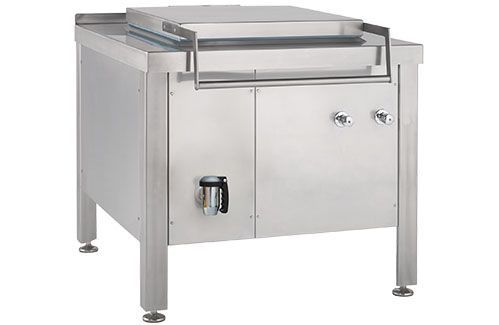 A stainless steel stove is sitting on top of a stainless steel cabinet.