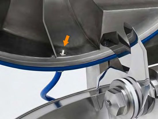 A close up of a stainless steel machine with a blue hose attached to it.