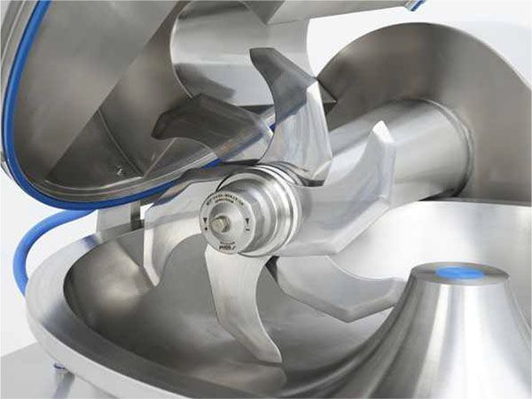 A close up of a stainless steel blade on a machine