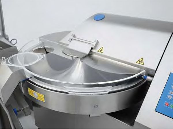 A close up of a stainless steel machine with a clear lid