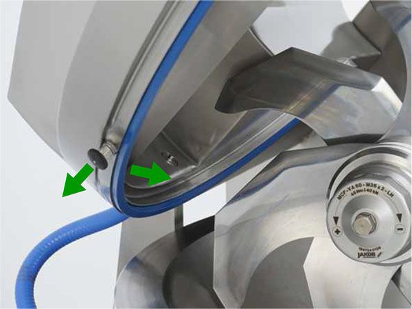 A stainless steel machine with a blue hose attached to it