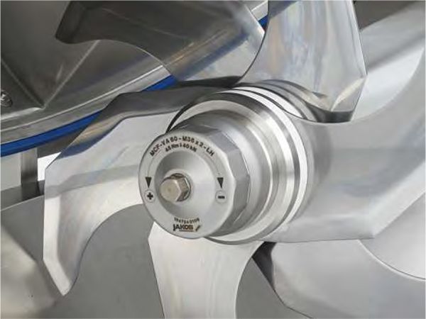 A close up of a stainless steel blade on a machine.