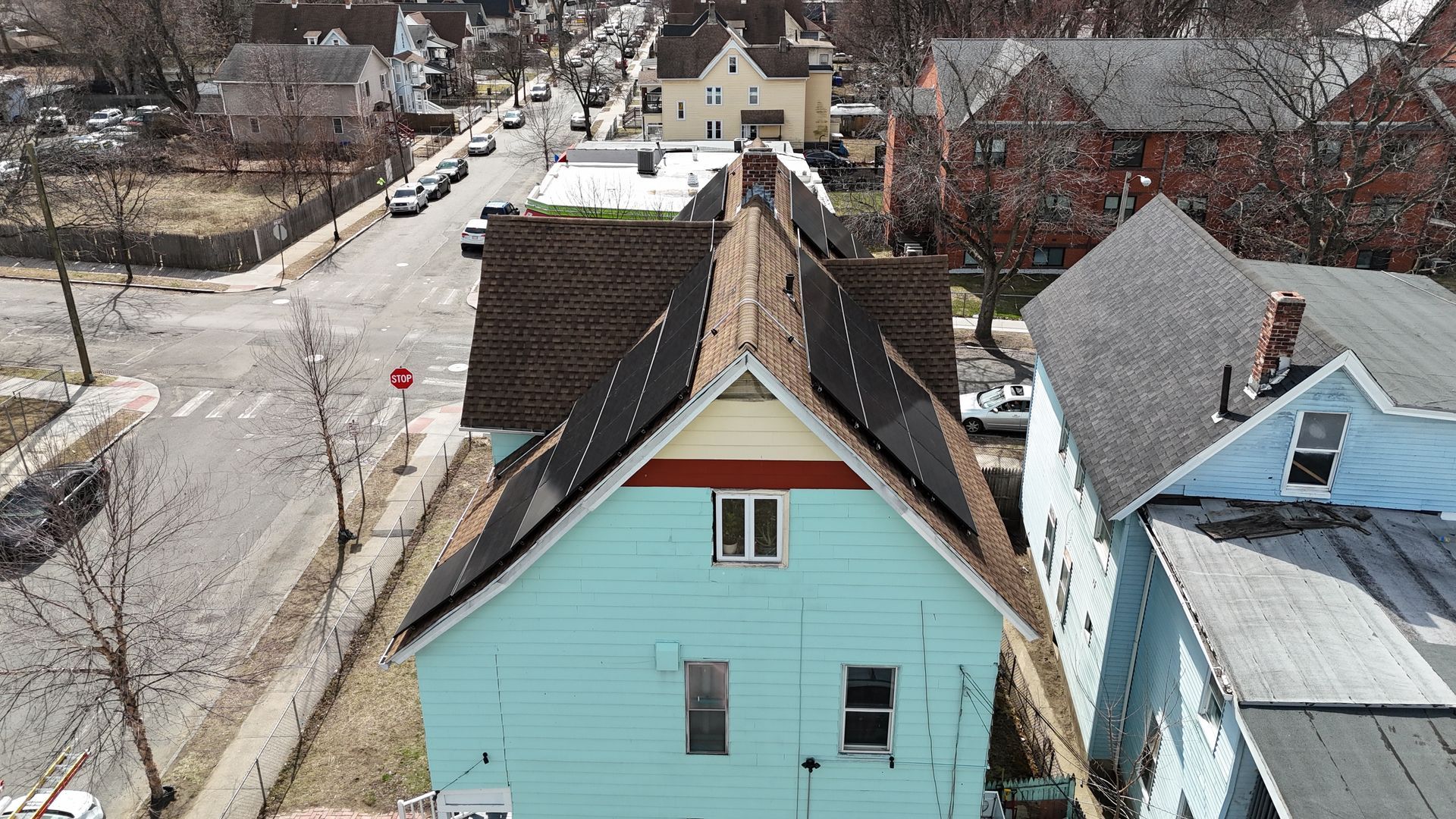 An aerial view of a house in a residential area