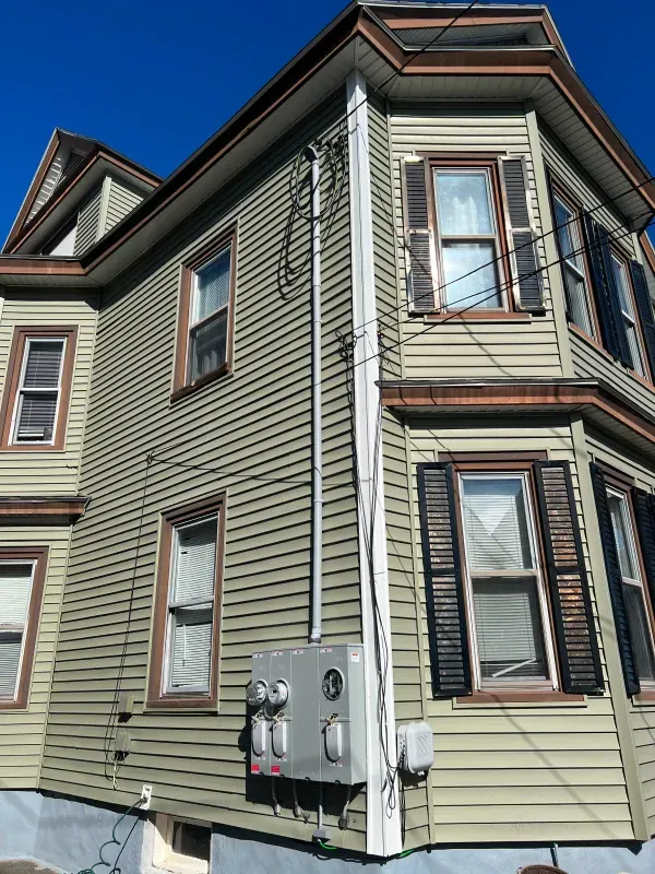 A house with a box on the side of it