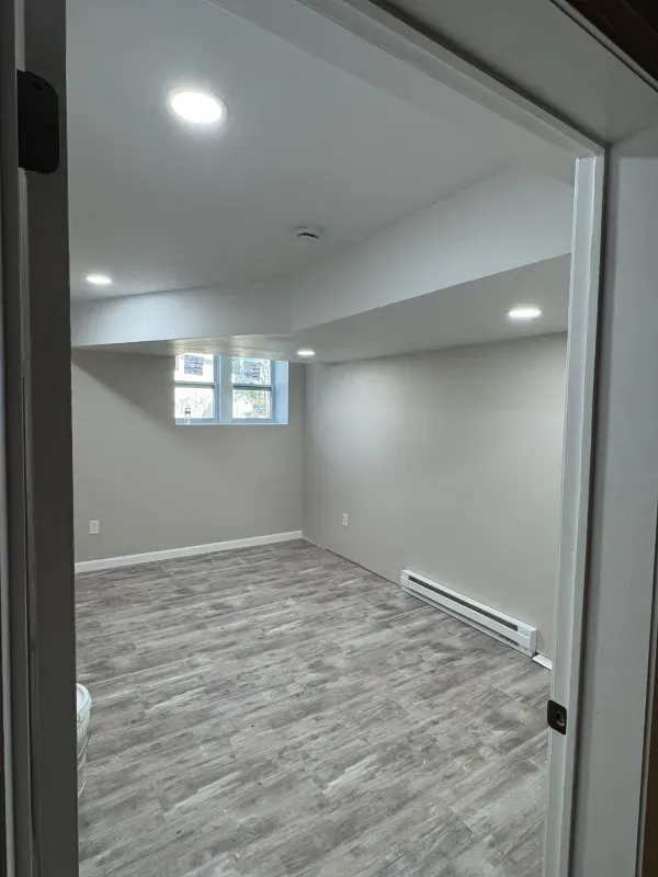 There is a window in the corner of the room.