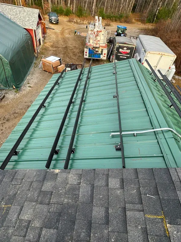 An aerial view of a green roof with a truck in the background.
