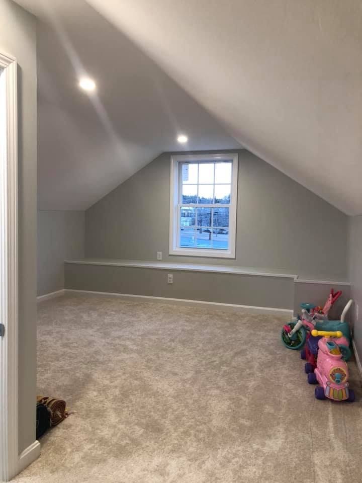 A room with a window and a lot of toys in it.