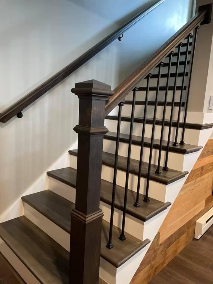 A staircase with wooden steps and a metal railing