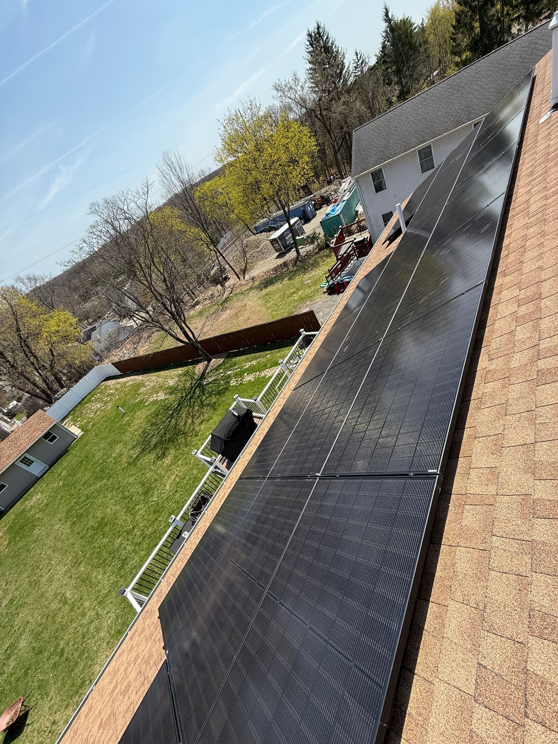 A roof with a lot of solar panels on it.
