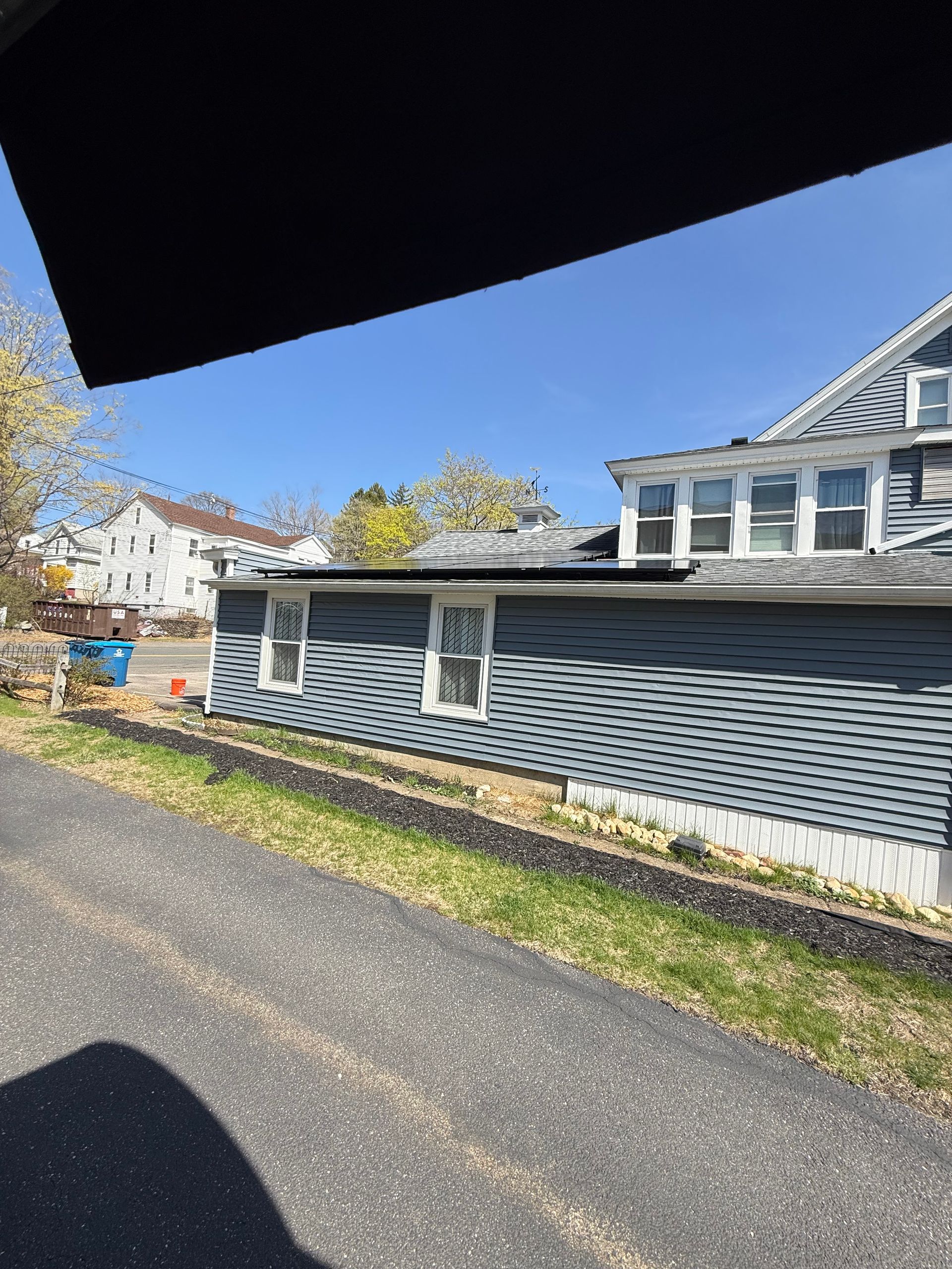 A house is being built on the side of a road.