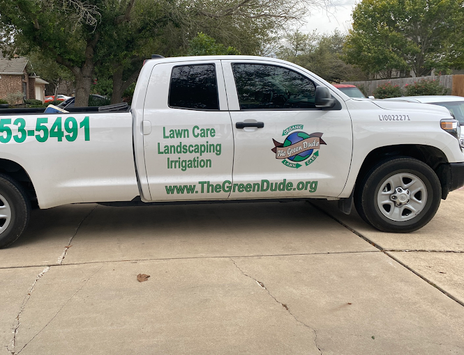 A white truck with lawn care landscaping irrigation written on it