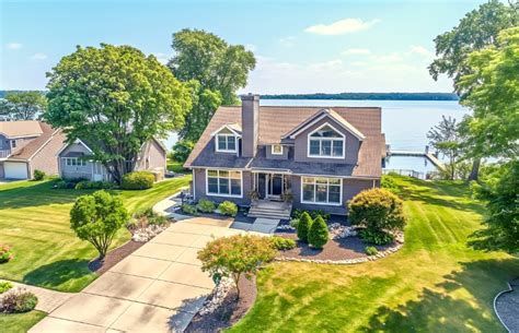 Clarkston, Michigan family in front of their new home—NEO Home Loans client-first mortgage philosoph