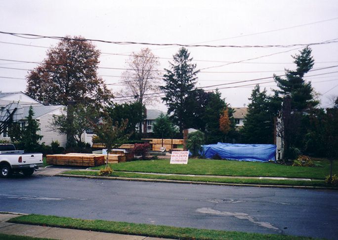 A white truck is parked on the side of the road