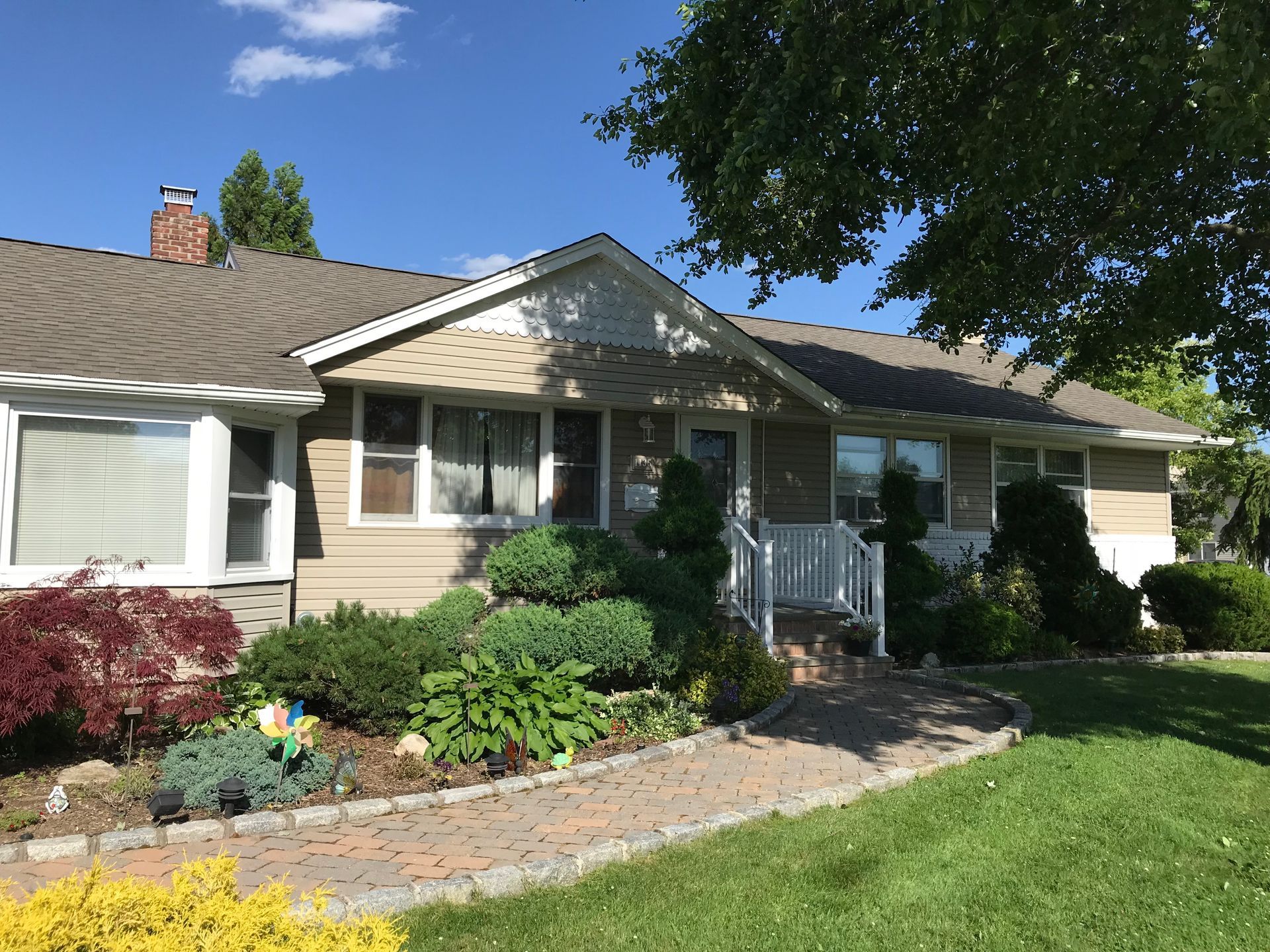 A house with a brick walkway leading to it